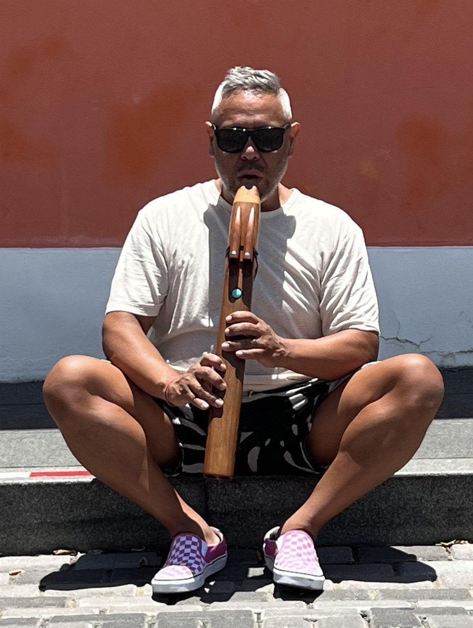 Nicholas Vidal playing the Mayan drone flute for a ceremony